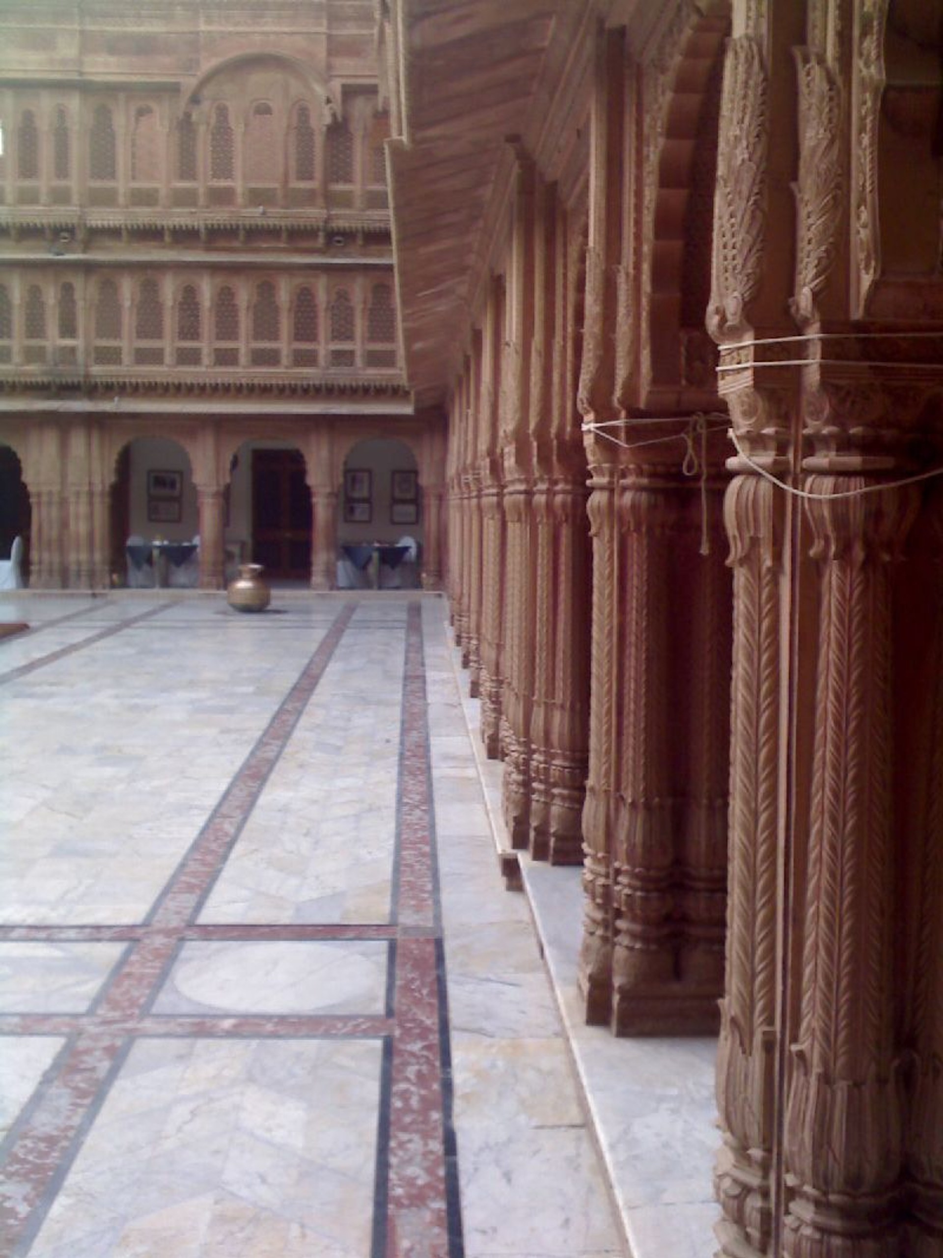 Carved sandstone colonnade at Laxmi Niwas Palace