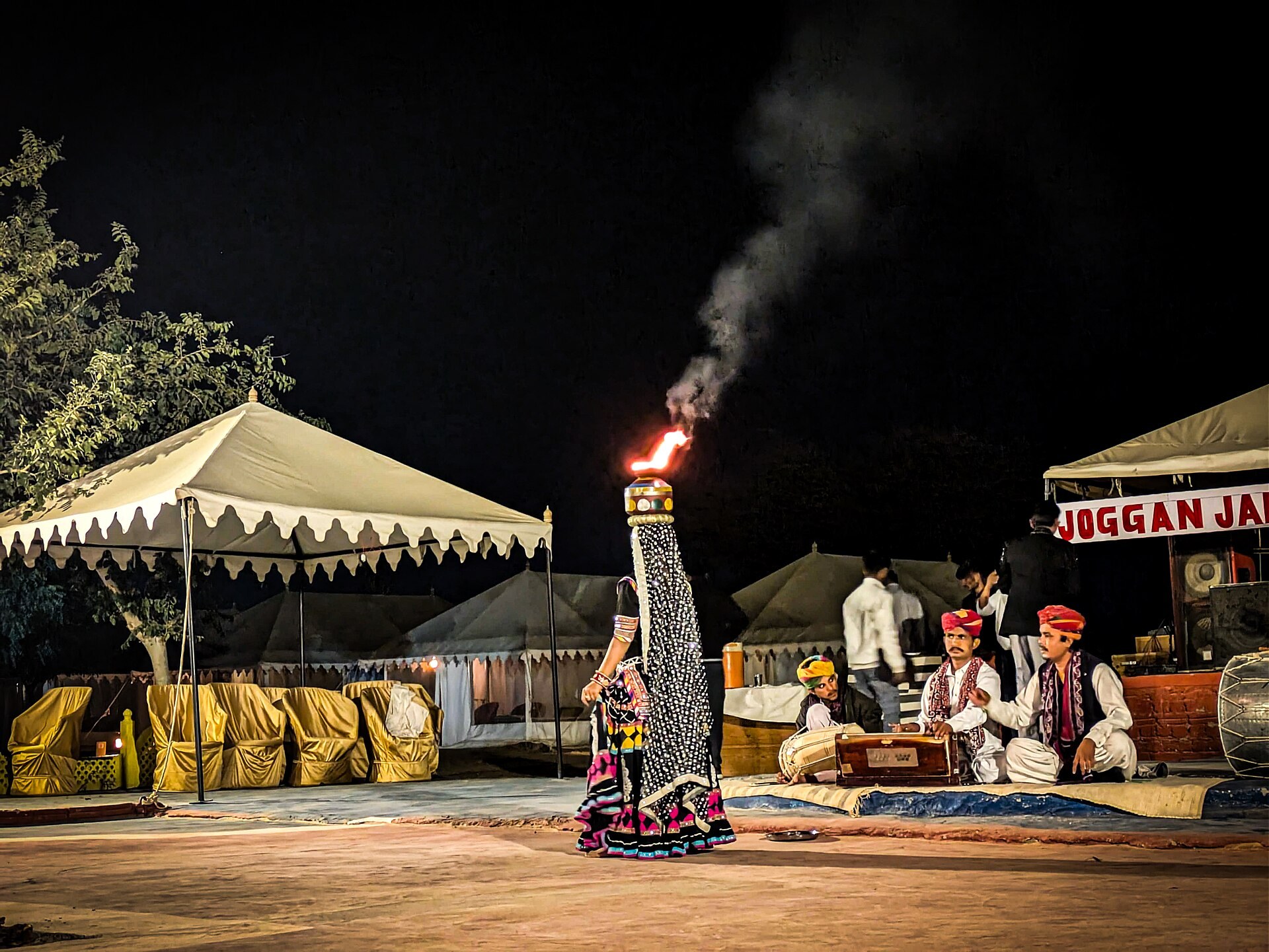 Rajasthani folk musicians performing by firelight